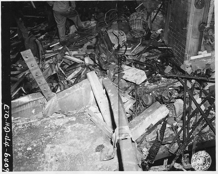 Debris around the bomb site. ID #: ETO-HQ-44-6409