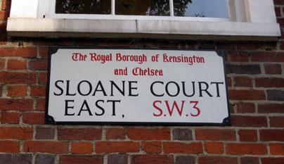 Sign marking Sloane Court East in Chelsea, London.